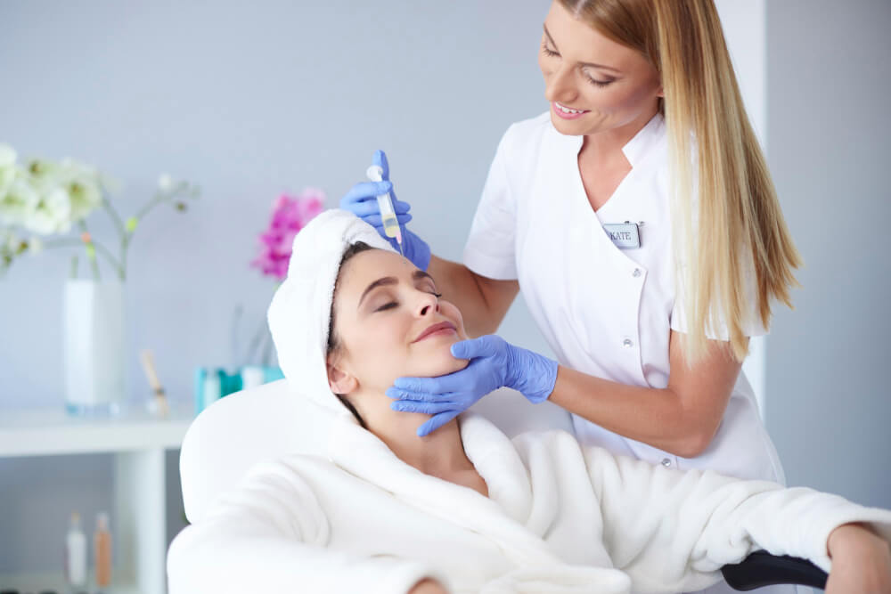 Woman receiving botox injection in the clinic