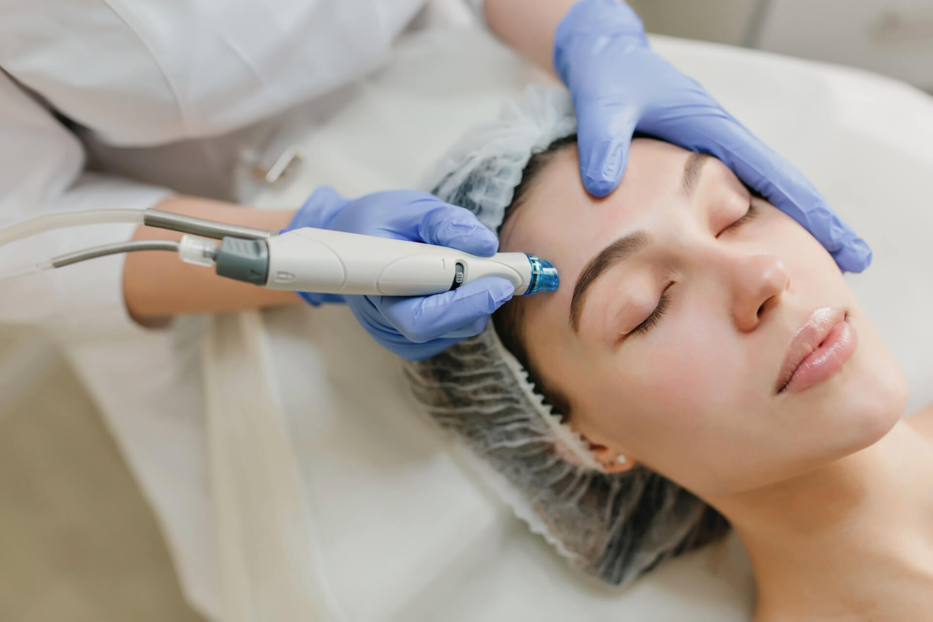 beautiful woman during cosmetology therapy in beauty salon