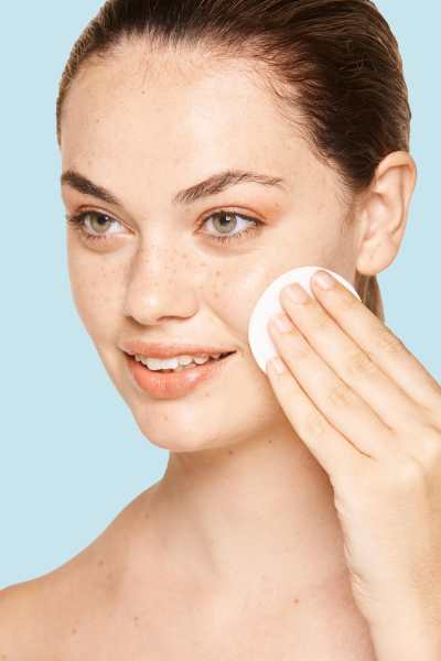 female applying toner