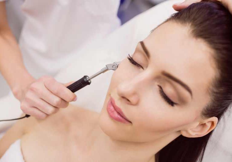 Dermatologist performing laser